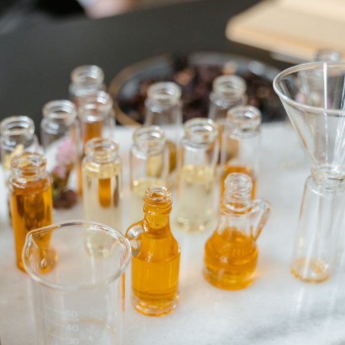 aromatherapy carrier oils in glass bottles and diluting