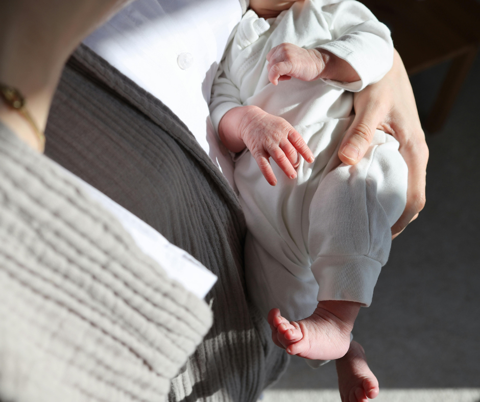 a baby safe in the mothers hands, providing safety